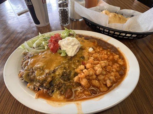 Blue corn enchiladas with chicken, posole, beans, sour cream