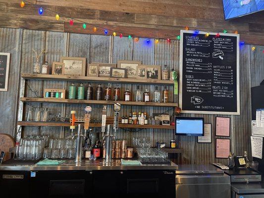 Bar area with distillery room to the right