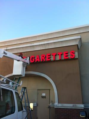 channel letters installation on top of 40ft building. Letters pre mounted on enclosed raceway