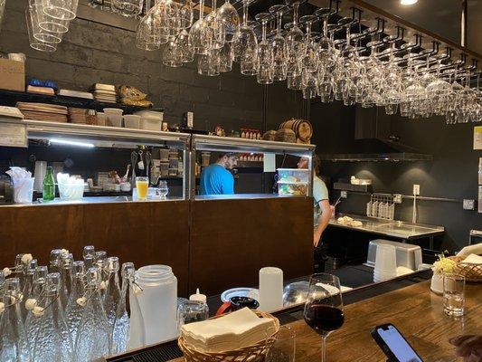 The open kitchen view from the bar.