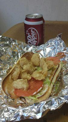 Shrimp po'boy, minus one shrimp I'd already sampled, being attended by the good Doctor. Note the nicely toasted bun.