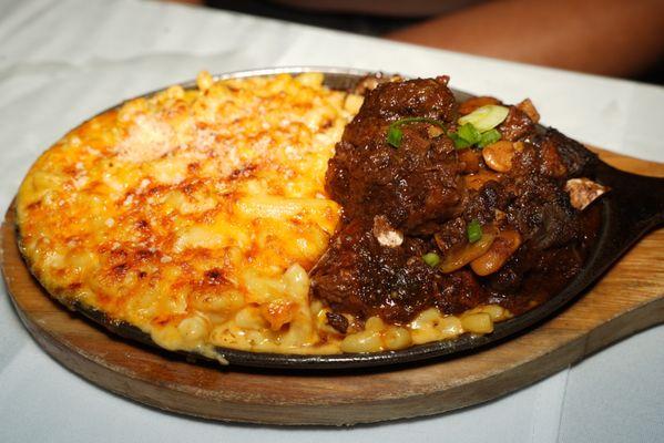 Jerk Oxtail Over Macaroni & Cheese Pie