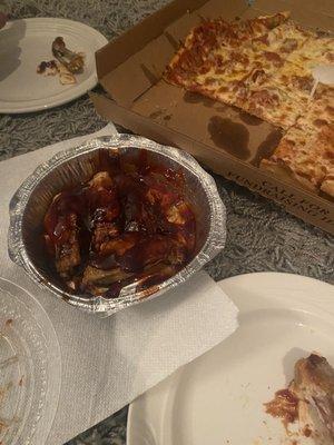 BBQ wings and their thin crust 1/2 sausage, pepperoni 1/2 cheese