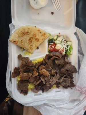 gyro platter with pita bread, salad, meat, and rice