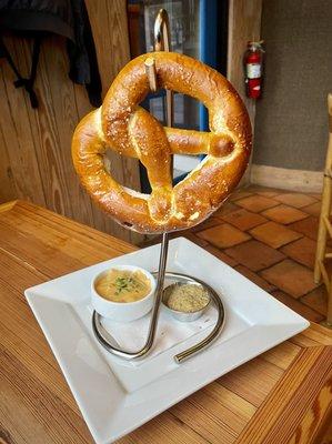 Pretzel with mustard and beer cheese