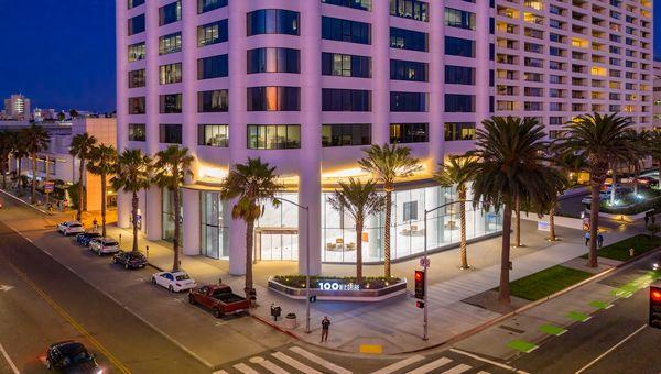 Corner view of 100 Wilshire Blvd. and Wilshire Blvd. at night