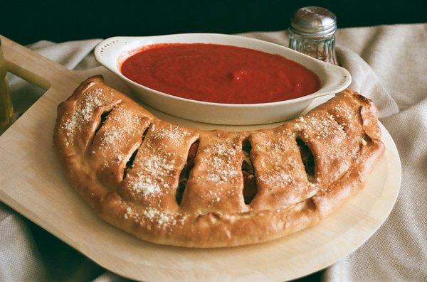 Large Calzone loaded with pepperoni, sausage, and cheese