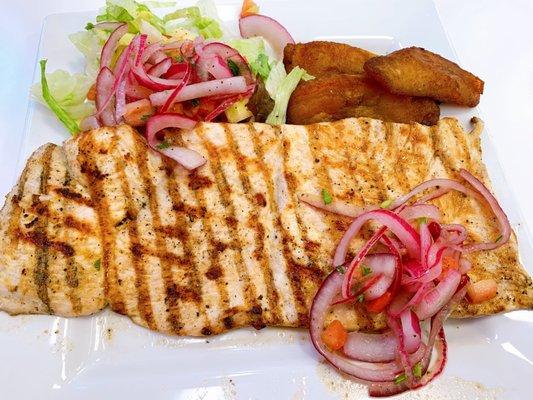 Grilled chicken with salad and maduros. The seasoning on the chicken is wonderful at this little place.