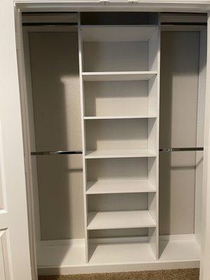 Guest closet with upper and lower rods that doubled the hanger space in the closet. Love this!!