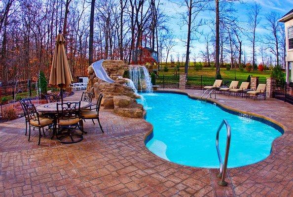 Fiberglass pool brick deck & waterfall with slide