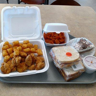 Pretty good amount of food for about $12. Buffalo wings with carrots and tots, pie and two Sammy's for later.