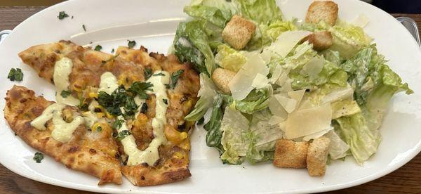 Caesar salad with flat bread. This all had a lot of salt added or topped to it as well