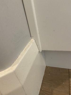 Photo of baseboard that said was cleaned