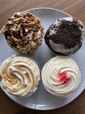 Top row: chocolate pretzel cupcake (left), cookies and cream (right)  Bottom row: salty caramel (left), red velvet (right )