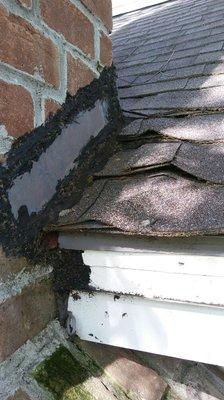 Chimney flashing raised and deteriorated.