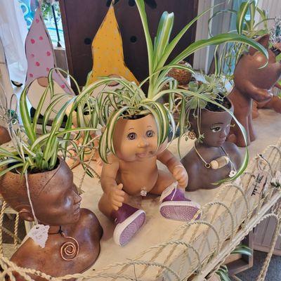 Fun and quirky baby doll head planters!