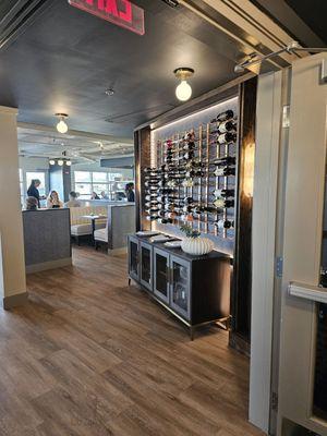 A wine bottle display at the entrance of the restaurant.