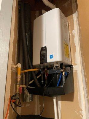 Navien tankless water heater installed in a triangular closet in my garage.