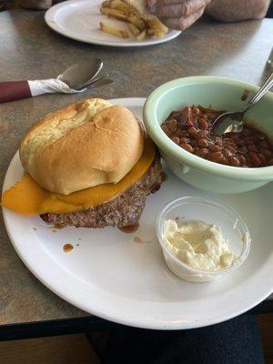 Rib eye sandwich with homemade baked beans.