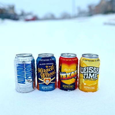 Hop & Sting beer cans chilling in the snow