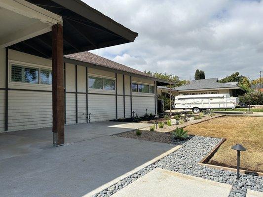 Newly poured concrete and steps with fresh landscape