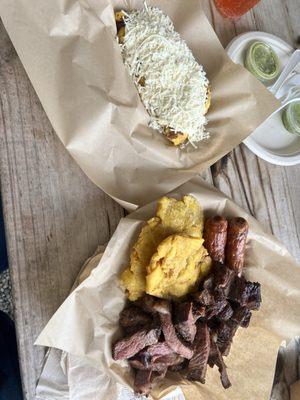 Cheese cachapa and platillo mixto made up of picañha, steak, chorizo and tostones.