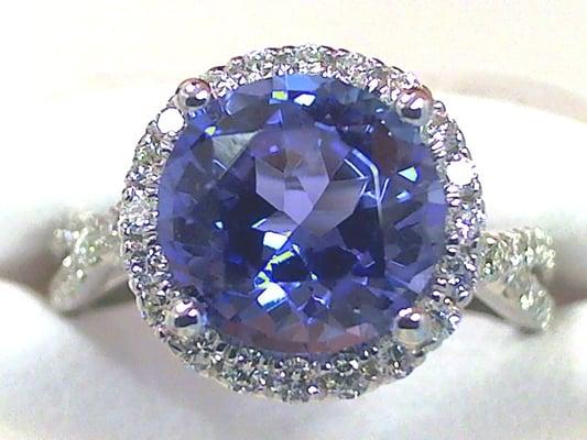 Just created! Beautiful Tanzanite halo ring with crossing side sholders.  Microbead set with round brilliant cut diamonds.