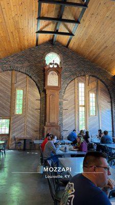 Gorgeous arched walls and weirdly gigantic clock.