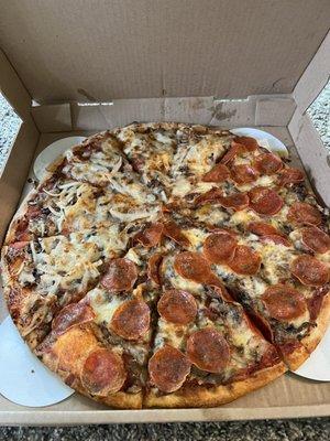 Half and half pizza. Loaded with toppings!