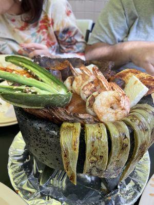 Gotta try the molcajete! Shrimp, chicken, asada, nopales, chorizo and a jalapeño with a slice of roasted queso fresco. Oh so good!!!