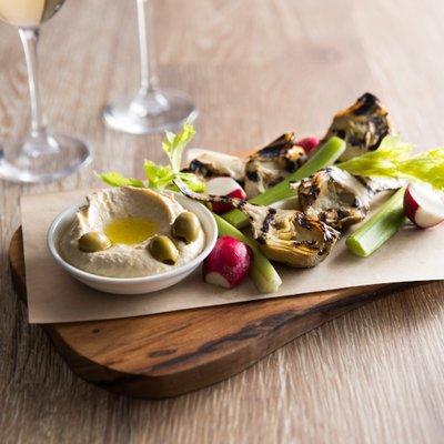 Grilled Artichokes with Preserved Lemon Hummus—celery hearts, radishes, crispy lavash, green olives