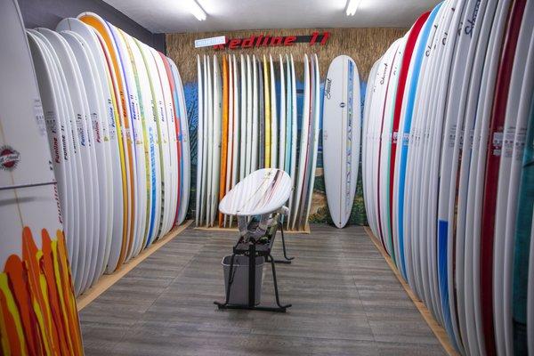 A peak inside the boardroom, where we have over 300 surfboards in stock at all times. Longboards, mid-lengths, shortboards, and soft-tops!