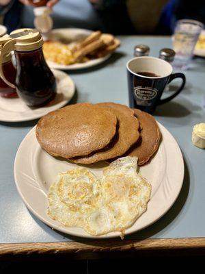 Whole Grain & Nut pancakes w/ eggs over. Pancakes dry, but delicious with the crunchy nuts. Exactly the healthy item I was looking for!