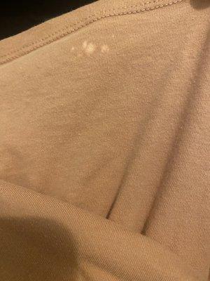 Bleach spots on multiple items.