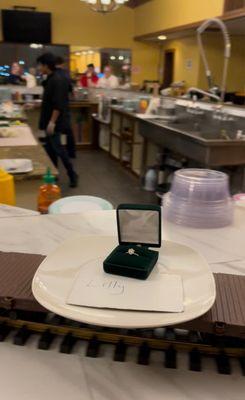 Engagement ring on the sushi train