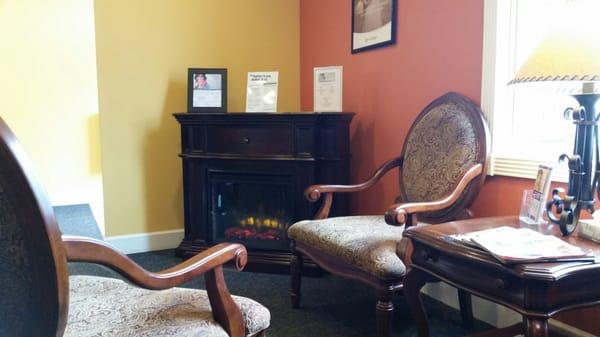 Just one section of their waiting room. Sitting in front of the heater/fireplace is great during the winter months.