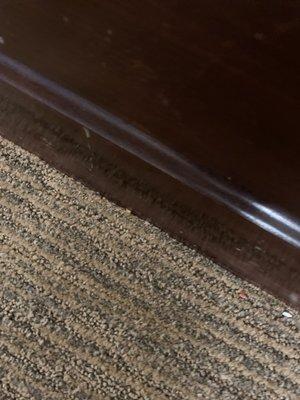 This is along the dresser. Stain and needs to be vacuumed.