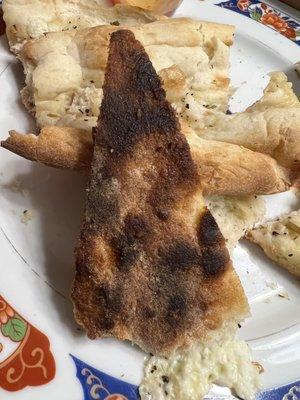 Whole bottom was burnt. It didn't look or taste like pizza