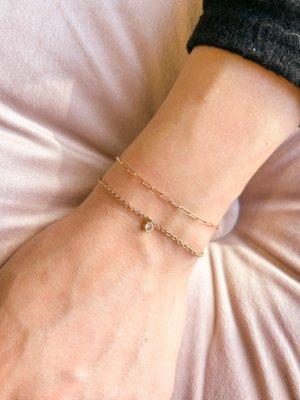 Rose gold permanent jewelry stack.