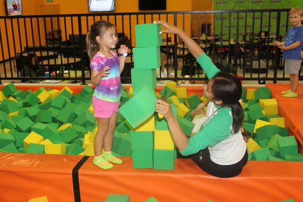 Our Rockin' Staff playing with a jumper during Tot Time!