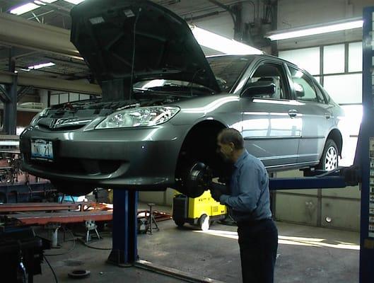 One of our qualified technicians inspecting the wear & operation of the braking system.