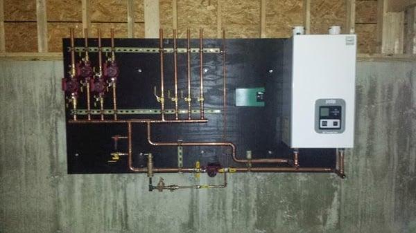 Replace existing oil boiler and replaced with new gas fired wall boiler.