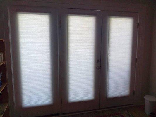 Cellular shades translucent fabric on doors