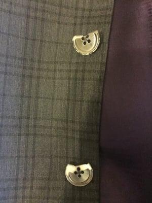 Suit buttons melted off after trip to Coppell Martinizing.