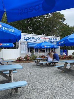 Plentiful outdoor seating with umbrellas