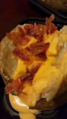 Baked potato with bacon and cheese