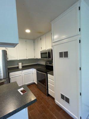 Refurbished and updated the utility and water heater  cabinets adjacent to  the  kitchen.