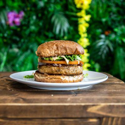 Seasoned Turk'y Burger, w/ Lettuce, , Onions, Tomatoes, Bomb Sauce, 
 on a Lightly Toasted Wheat Bun