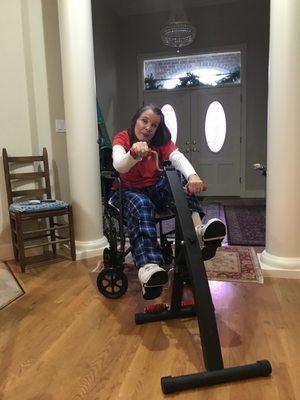 Mary hard at play with her exercycle.