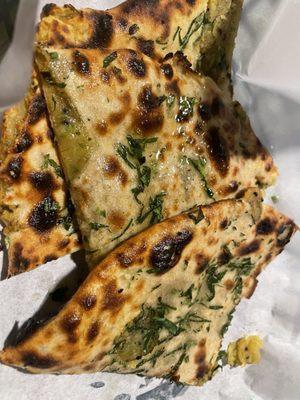 Aloo Paratha, made to order roti bread stuffed with a thin layer of potato